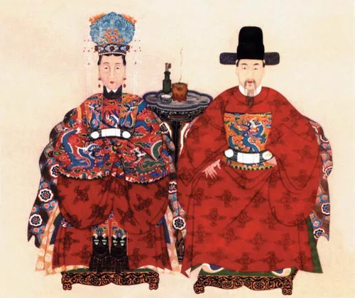 ภาพเหมือนสมัยหมิงของขุนนางสิงเจี้ย 邢玠 แซ่สิง กับภรรยา นั่งเคียงกัน สวมชุดสีแดงปักลาย ระหว่างกลางมีโต๊ะเล็กวางกระถางธูป